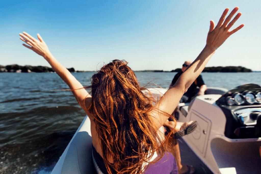 Redheaded Woman on a Boat Trip in Agadir - Radiating joy, enjoying the scenic views and sea breeze