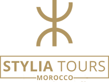 A sleek and elegant logo featuring the Stylia Tourse in gold