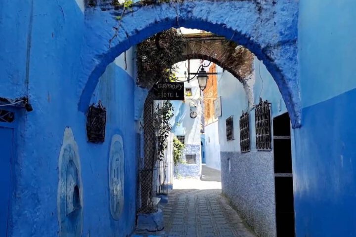 Blue alleyway in Chefchaouen with vivid doors and walls – Best Morocco Tour Styles