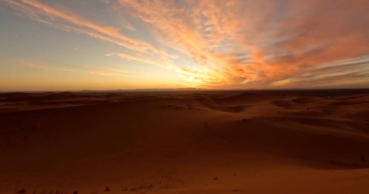 Explore Merzouga’s sunset over Sahara’s golden dunes.