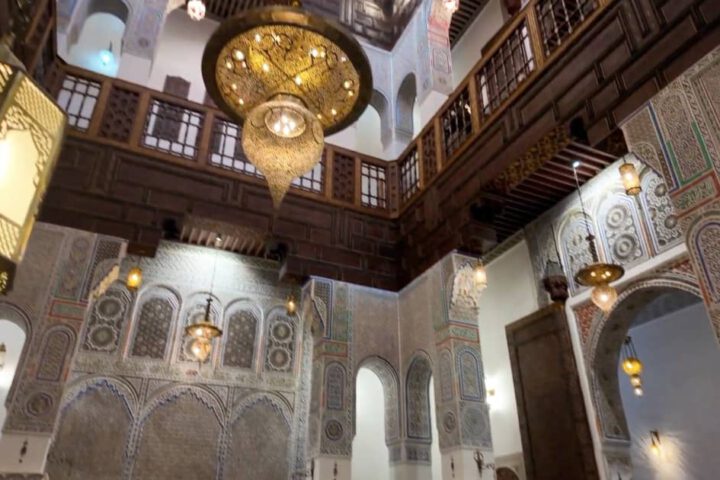 The elegant patio of a riad in Fez, showcasing Moroccan design and craftsmanship, as part of Stylia Tours’ luxury travel experiences.