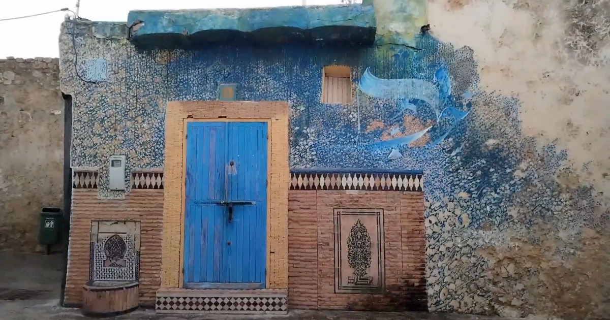 Vibrant murals on the walls of Asilah’s medina, showcasing the town’s art and history.