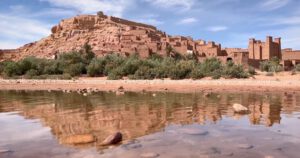 Ait Benhaddou Kasbah – UNESCO World Heritage Site in Morocco Ancient Kasbah of Ait Benhaddou at sunset with golden mudbrick walls Title: Caption: Walk through the cinematic Kasbah of Ait Benhaddou, where centuries of culture and history blend into Morocco’s red desert landscape.