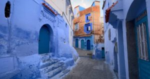 Chefchaouen – The Blue Pearl of Morocco Blue-painted alleyway in Chefchaouen with pots and arched doors