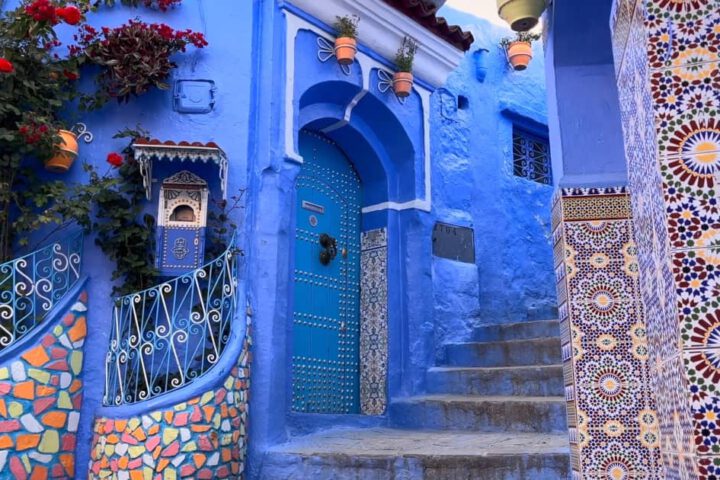 Traditional blue medina street with doorways and steps in Chefchaouen