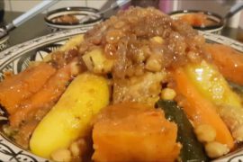 Moroccan Couscous Bidaoui with seven vegetables and sweet tfaya topping, prepared during a Casablanca cooking class shore excursion.