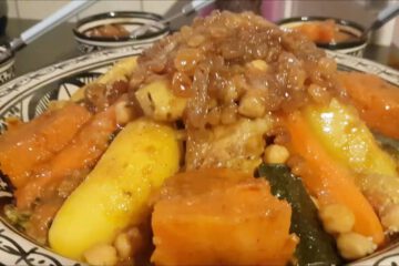 Moroccan Couscous Bidaoui with seven vegetables and sweet tfaya topping, prepared during a Casablanca cooking class shore excursion.