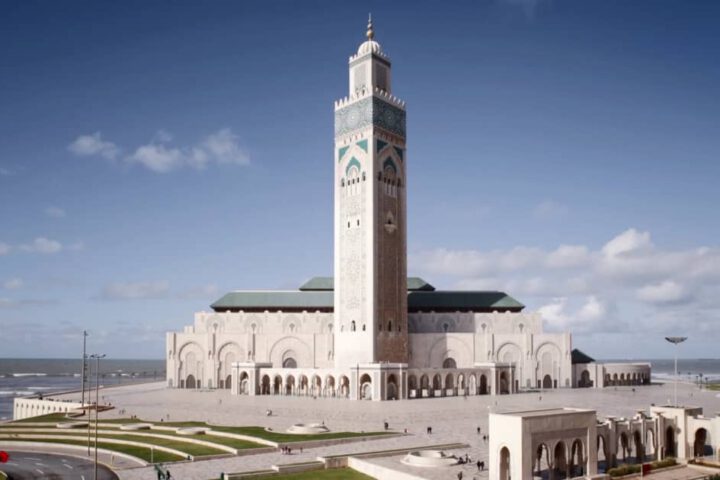 Hassan II Mosque rising above the Atlantic Ocean with intricate Moroccan design