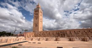 Koutoubia Mosque – Icon of Marrakesh’s Skyline Koutoubia Mosque with palm trees and red city walls in Marrakesh