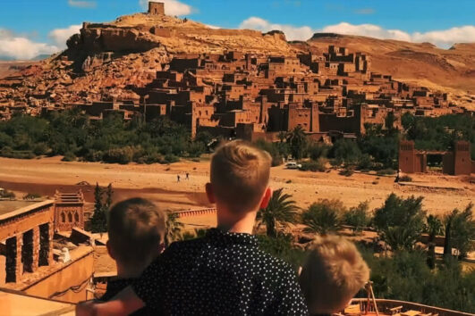 Family exploring Aït Benhaddou during the 11-day Morocco family tour – Marrakesh, Atlas & Desert