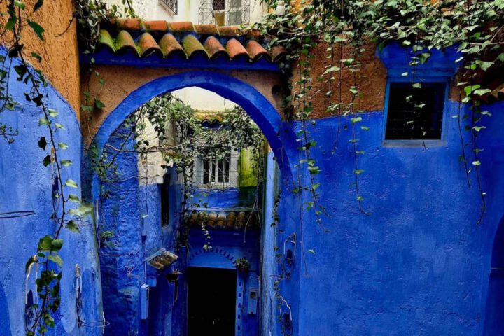 Close-up of authentic Moroccan craftsmanship and blue-painted stone stairs in Chefchaouen.