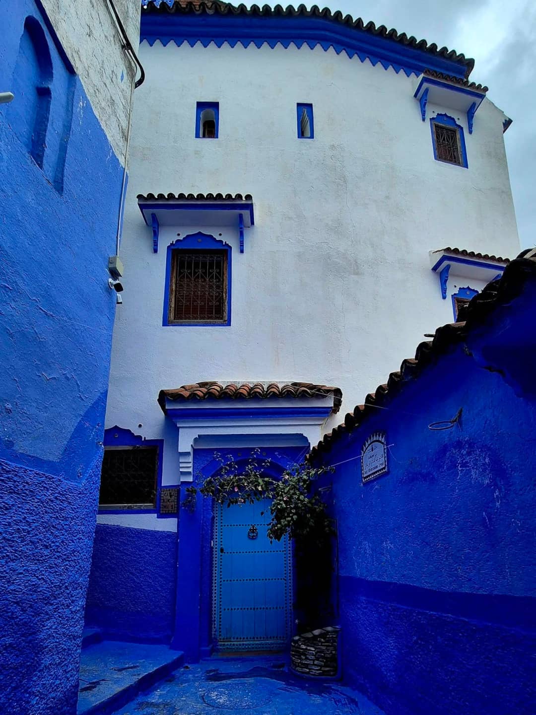 View of tiered blue houses in Chefchaouen, showcasing the city’s unique Rif Mountain setting.