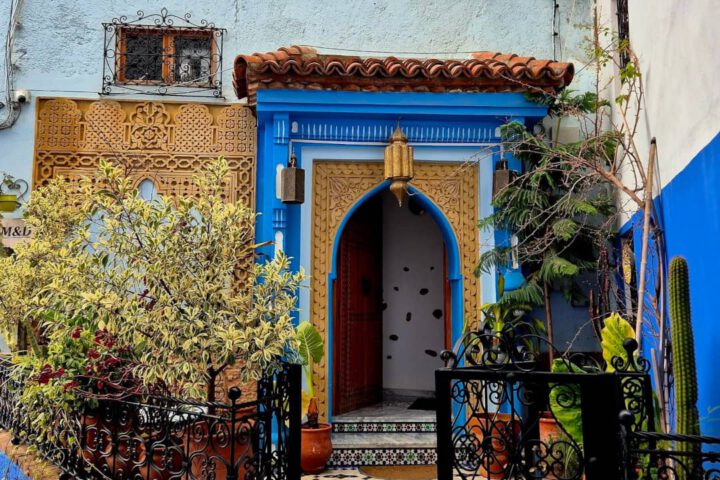 Vibrant blue street scene in Chefchaouen, optimized for luxury Morocco travel inspiration.