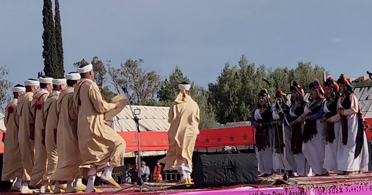 Men and women performing traditional dance at the Rose Festival in Kelaat M’Gouna, Morocco