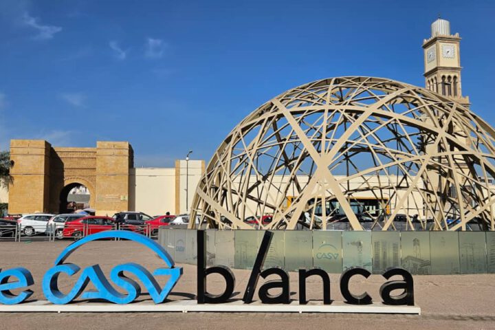 WeCasablanca sign and modern square with clock tower in downtown Casablanca