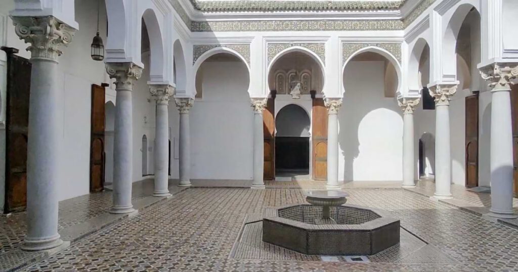 Courtyard of the Kasbah Museum in Tangier featuring arches, columns, and traditional Moroccan mosaic tiles