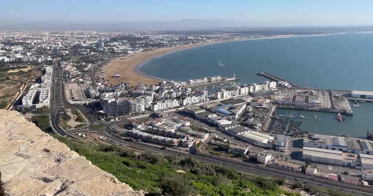 Agadir Port Panorama – Shore Excursions in Morocco shore excursions in Morocco panoramic view of Agadir port, marina, Atlantic beach, and city coastline