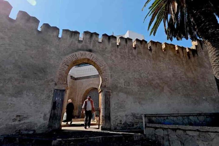 Traditional entrance gate to the historic medina of Tetouan Morocco with stone walls and archway